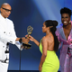 Regina King (c) accepts the Outstanding Lead Actress in a Limited Series or Movie award for ‘Seven Seconds’ from RuPaul (L) and Leslie Jones (R) onstage during the 70th Emmy Awards on September 17, 2018 in Los Angeles, California.